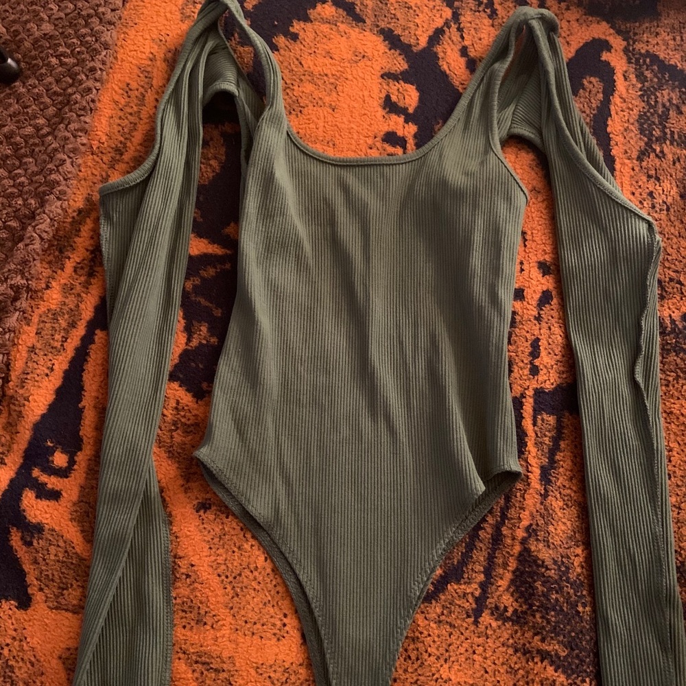 Green body suit sleeves cut out